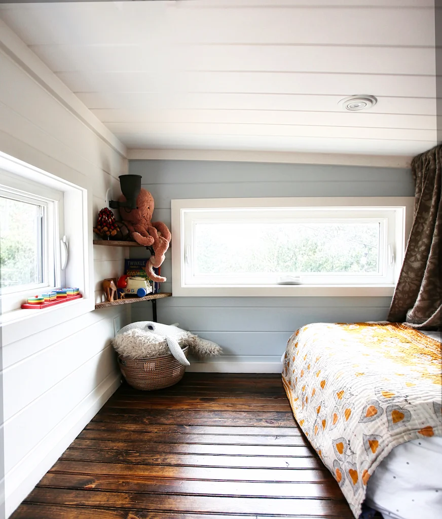 Tiny house interior showing distinct living spaces